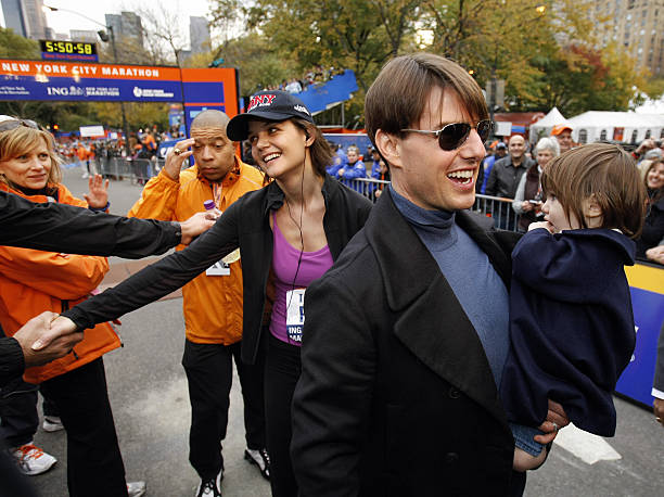 Tom Cruise holds his daughter